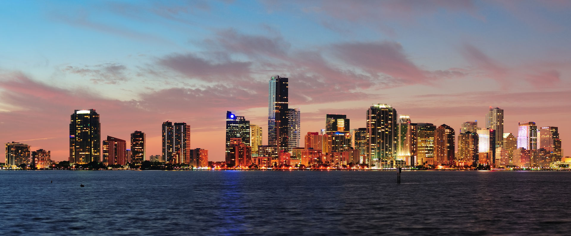 The Miami skyline at sunset, seen across Biscayne Bay